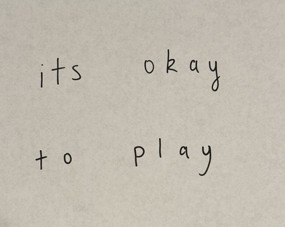 picture of a piece of paper with the words 'its okay to play' written on it