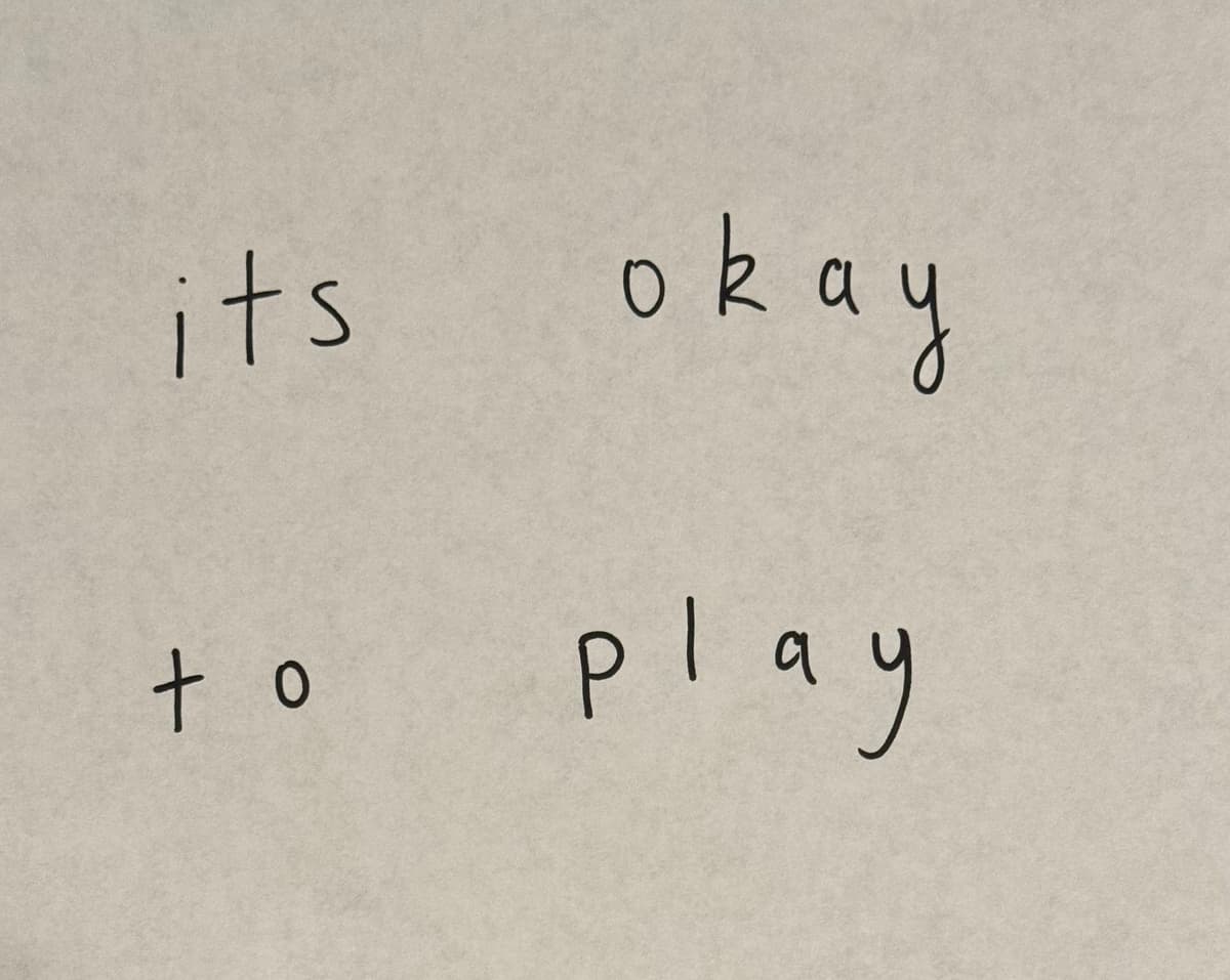 picture of a piece of paper with the words 'its okay to play' written on it